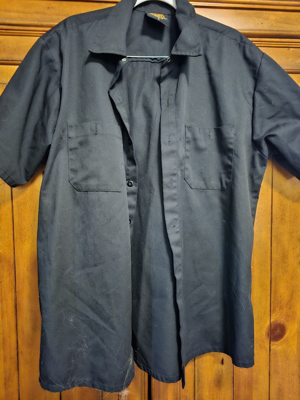 ) – A solid black button-up heavy-duty work shirt from Milwaukee Leather